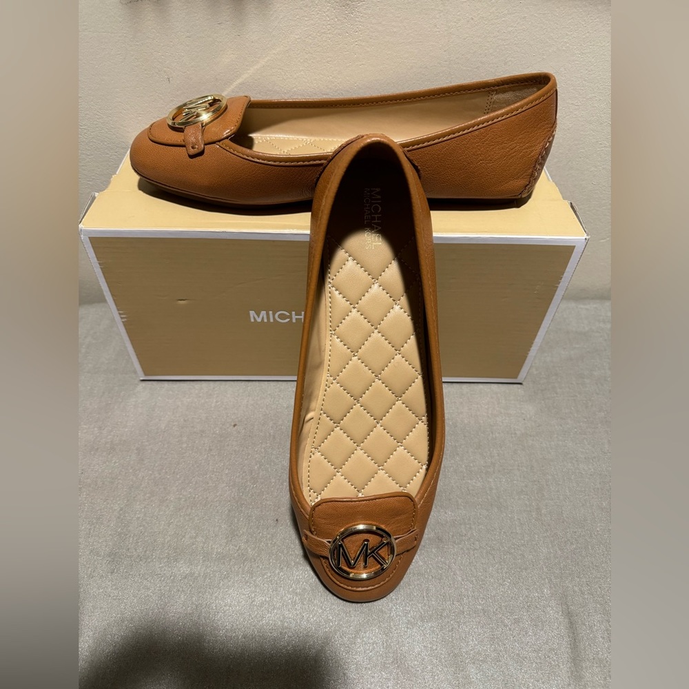 Michael Kors leather moccasins in Luggage color size 9.5 M. Gold color MK logo.